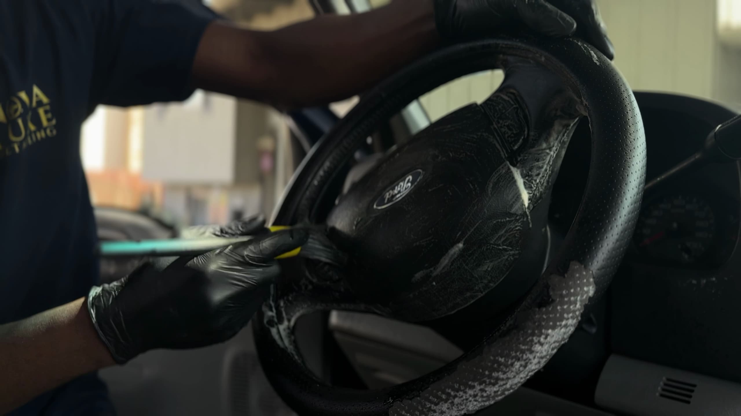 Wheel and tyre being cleaned with dedicated brushes